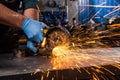 A young man welder grinder Royalty Free Stock Photo