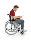 Young man in wheelchair using tablet Royalty Free Stock Photo
