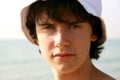 The young man and a white cap 1 Royalty Free Stock Photo