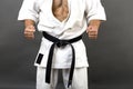 Young man in white kimono and black belt training martial art Royalty Free Stock Photo