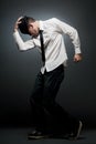 Young man in white shirt and black hat dancing. Royalty Free Stock Photo