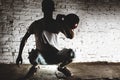 Young man in a white t-shirt holding a red kettlebell Royalty Free Stock Photo