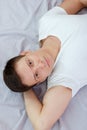 Young man in white t-shirt and underwear sitting or sitting on a Royalty Free Stock Photo