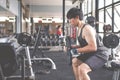 The young man who beginner training with free weigth in gym. Fitness concept.Fitness muscular body