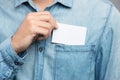 Young man who takes out blank business card from the pocket of h Royalty Free Stock Photo