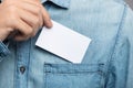 Young man who takes out blank business card from the pocket of h Royalty Free Stock Photo