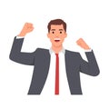 Young man winning at work. Businessman with strong emotions on his face wearing business suit. Fist up happy