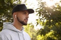 Young man with wireless headphones listening to music. Space for text Royalty Free Stock Photo