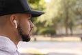 Young man with wireless headphones listening to music. Space for text Royalty Free Stock Photo