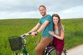 Young man and woman on bicycle Royalty Free Stock Photo