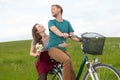 Young man and woman on bicycle Royalty Free Stock Photo