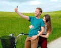 Young man and woman on bicycle Royalty Free Stock Photo