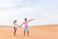 Young Man Woman In Desert Beautiful Couple Asian Girl And Guy Point Finger Sand Dune Royalty Free Stock Photo