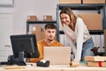 Young man and woman ecommerce business workers having video call at office Royalty Free Stock Photo