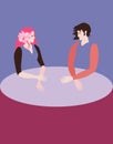 Young man and woman with expressive faces sit at a large round table and look at each other. Emptiness instead of body.