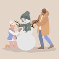 Young man and woman having fun making snowman