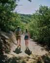 Young Couple Hiking to the remote fairytale medieval castle Burg Eltz, Germany Royalty Free Stock Photo