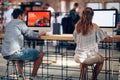 Young man and woman in internet coffee browsing, learning, working Royalty Free Stock Photo