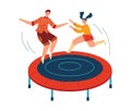 Young man and woman jumping on trampoline, casual clothes, happy, active fun. Joyful friends enjoying playful activity Royalty Free Stock Photo