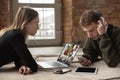 Young man and woman participate video conference looking at laptop screen during virtual meeting, videocall webcam app Royalty Free Stock Photo