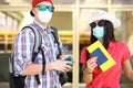 Young man and woman with passport and ticket in hand are waiting for the flight