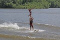 Young man and woman performing in ski show on Mohawk River