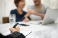 Young man and woman planning with professional consultant.