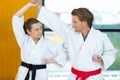 young man and woman practicing karate in dojo Royalty Free Stock Photo