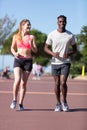 young man and woman runners