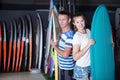 Young man and woman satisfied of choose surfboard Royalty Free Stock Photo