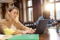 Young man and woman studying in the library ad looking focused Royalty Free Stock Photo