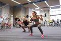 Young man and woman training with barbell in gym Royalty Free Stock Photo