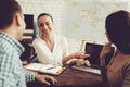 Young Man and Woman in Travel Agency with Manager. Royalty Free Stock Photo