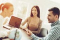 Young Man and Woman in Travel Agency with Manager. Royalty Free Stock Photo