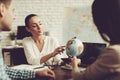 Young Man and Woman in Travel Agency with Manager. Royalty Free Stock Photo