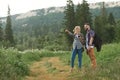 Couple navigate with smart phone while hiking