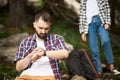 Couple navigate with smart watch while hiking