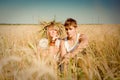 Young man and woman on wheat field Royalty Free Stock Photo