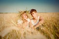 Young man and woman on wheat field Royalty Free Stock Photo