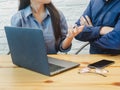 Young man and woman working in the office. Business woman explaining the project to business man. Coworking, Teamwork, Business Royalty Free Stock Photo