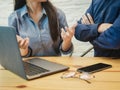 Young man and woman working in the office. Business woman explaining the project to business man. Coworking, Teamwork, Business Royalty Free Stock Photo