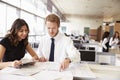 Young man and woman working together in architect?s office Royalty Free Stock Photo