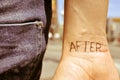 Young man with the word after tattooed in his wrist