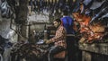 Young man work hard in the leather factory inside the dharavi slum in mumbay Royalty Free Stock Photo