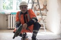 A builder with a hammer drill. Royalty Free Stock Photo