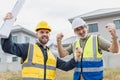 Young man worker construction engineer male working cooperate with senior project supervisor in construction site happy smile Royalty Free Stock Photo