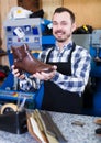 Young man worker displaying result of his work Royalty Free Stock Photo