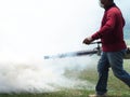 Young man worker are working fogging to eliminate mosquitoes