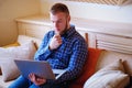 Young man working absorbed on laptop at home Royalty Free Stock Photo