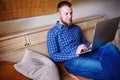 Young man working absorbed on laptop at home Royalty Free Stock Photo